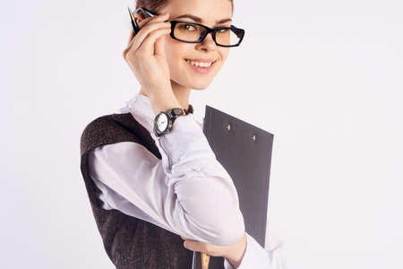 Young beautiful woman in glasses on white isolated background, teacher, teach.