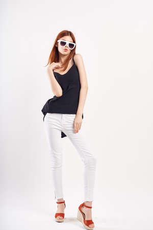 Young beautiful woman on white isolated background in sunglasses, fashion, beauty, style.の写真素材