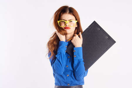 Young beautiful woman in yellow glasses on a white background.の写真素材
