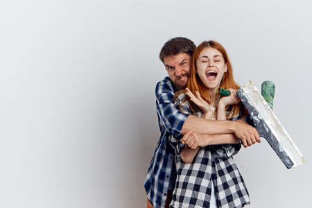 Man with a beard on a white background with a young woman repairing, friendship, emotion.の写真素材
