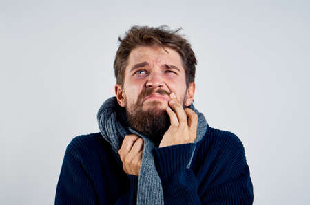 Man with a beard on a white background, cold.の写真素材