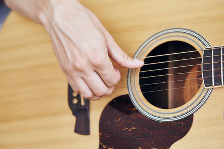 Music, musical instruments, strings, guitars, man, hand.