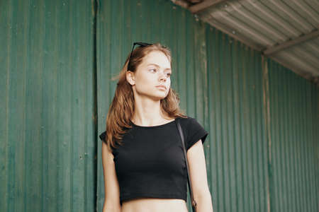 Woman outdoors in the city in summer.の写真素材