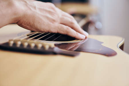 Man holds a guitar, strings, musical instruments, music.の写真素材