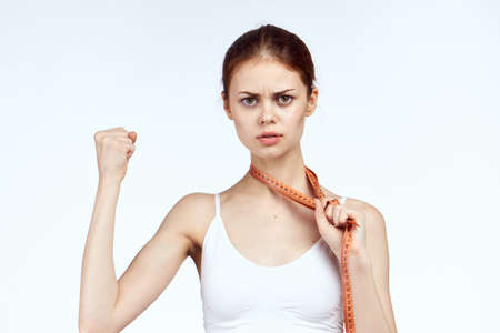 Beautiful woman on a white background, portrait, fitness, sport, slimming, diet.の写真素材