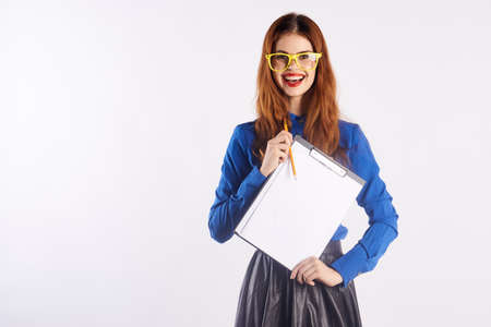 Beautiful woman holding documents.の写真素材