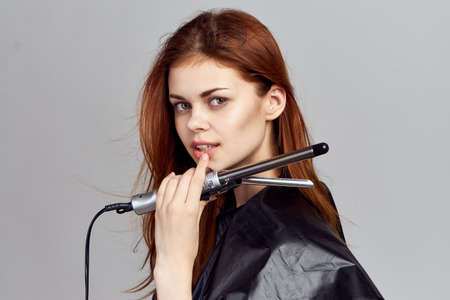 A woman holding a ploy.の写真素材