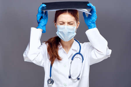 Female doctor in medical mask.の写真素材