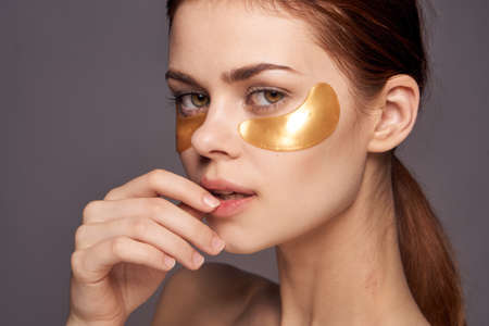 Woman in golden patches for the eyes.の写真素材