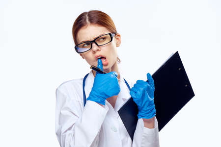 Woman doctor holding documents.の写真素材