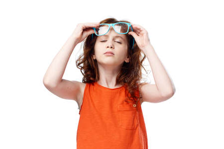 Little girl puts on glasses.の写真素材