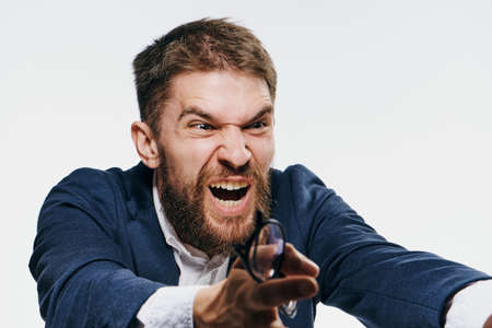 Business man on a white background, emotions.
