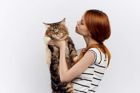 Beautiful woman holding a cat.