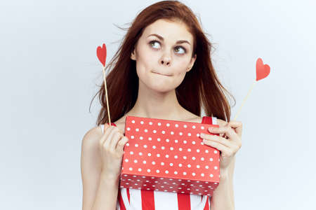 Portrait of a beautiful woman, gift box, paper accessories for parties.の写真素材