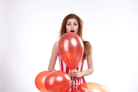 Woman, balloons, emotions, white background.の写真素材