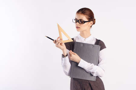 the teacher in glasses keeps documents and ruler, empty space for copying.の写真素材