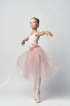 little girl on white isolated background, ballerinas, dancing.の写真素材
