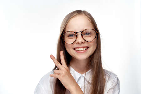 little girl with glasses, portrait, close-up, smile.の写真素材