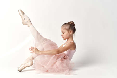child, girl ballerina on a white background.の写真素材
