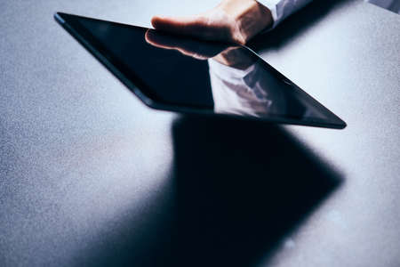 hand, tablet, table.の写真素材