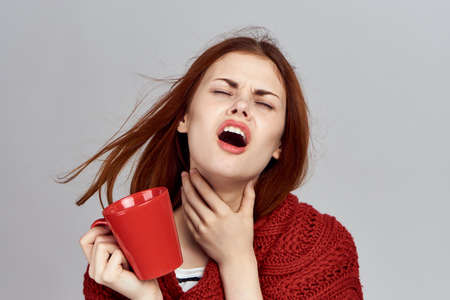 Sore throat, portrait, woman sick.の写真素材