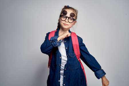 schoolgirl on a gray background.の写真素材