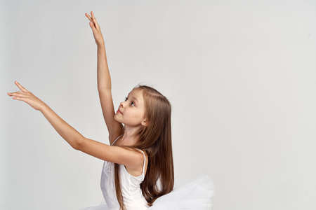 Girl ballerina stretches.の写真素材