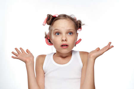 little girl in curlers, portrait, emotions.の写真素材