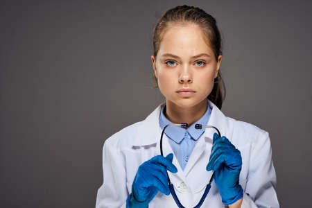 Doctor holding a stethoscope, blank space for copying.の写真素材