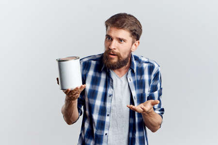 man holding building paint.の写真素材