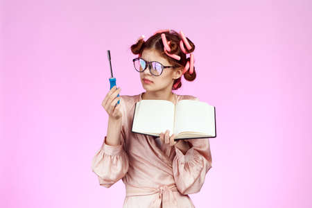 woman housewife, housework, pink background.