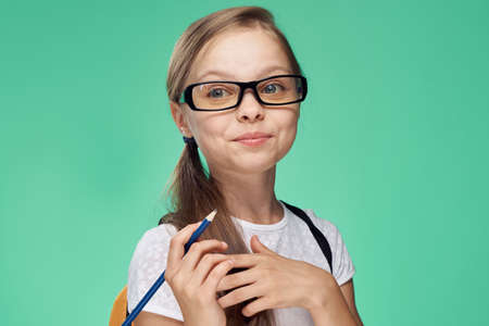 little girl with glasses, portrait, schoolgirl.の写真素材