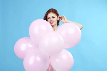 young beautiful woman holds balloons.の写真素材