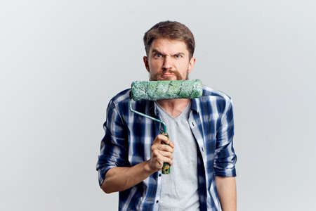 man holding a construction roller.の写真素材
