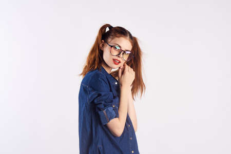 girl teenager with glasses on white background.の写真素材