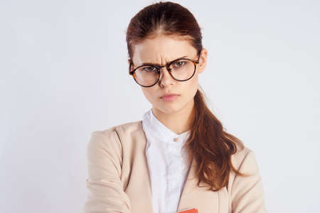 woman in glasses frowns, portrait.の写真素材