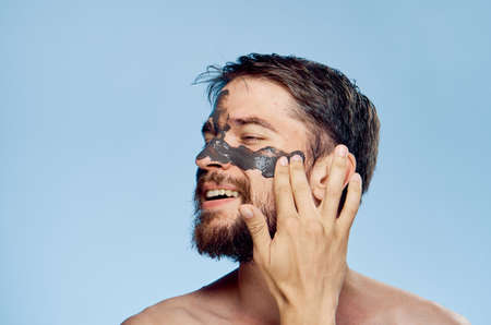 man, clay cosmetic face mask.の写真素材