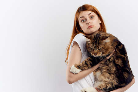 emotions, cat, woman, white background.の写真素材