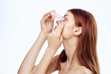 the woman is burying her eyes.の写真素材