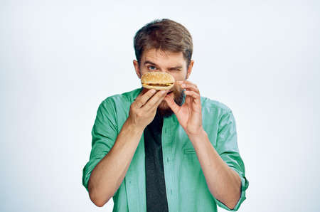man looking at a hamburger.