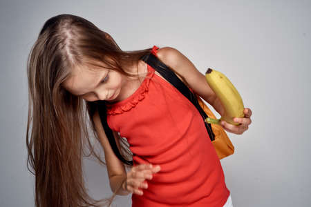 little girl with a banana.