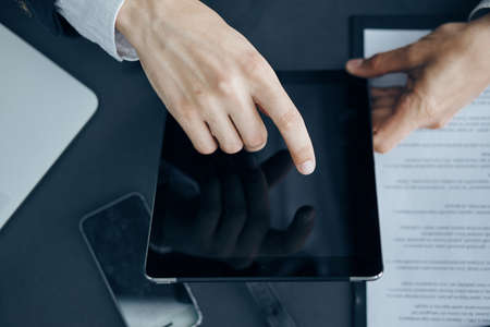 business man with a tablet in black.