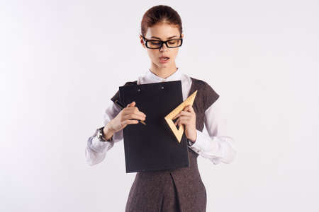 teacher with notebook and triangle in confusion.の写真素材
