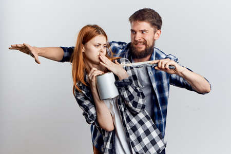 A man and woman on a light background interact with each other.の写真素材