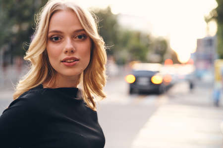 portrait of a beautiful girl in the background of the city.の写真素材