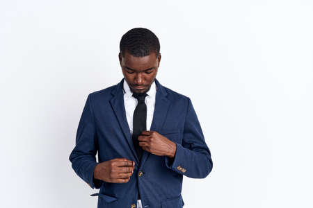 black man in suit on white background.の写真素材