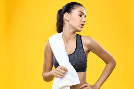 the sportswoman with a towel looks away.の写真素材