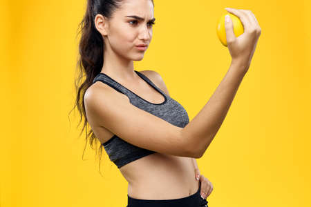 the sportswoman with the orange is unhappy.の写真素材