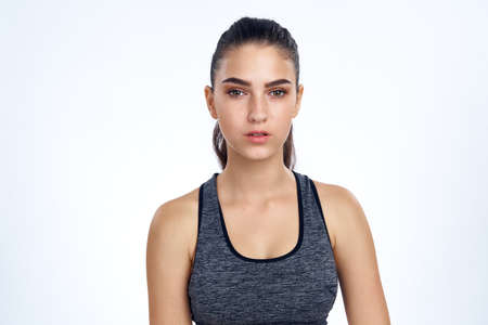 sporty girl on a white background.の写真素材