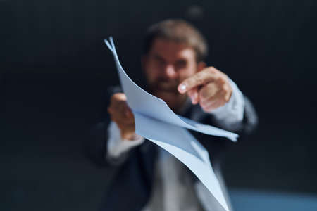 businessman pointing at papers.の写真素材